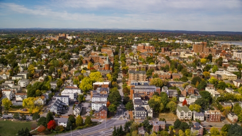 AX147_325.0000213 - Aerial stock photo of Apartments and Saint Dominics Roman Catholic Church, autumn, Portland, Maine
