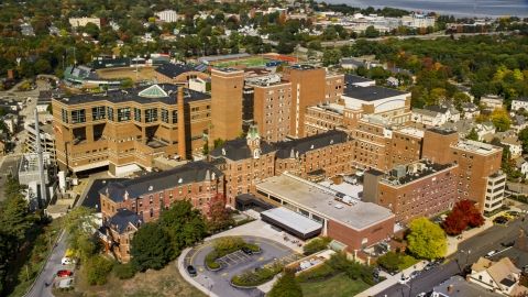 AX147_353.0000389 - Aerial stock photo of A hospital building, the Maine Medical Center, autumn, Portland, Maine