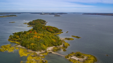 AX147_367.0000078 - Aerial stock photo of Clapboard Island with colorful autumn trees, Falmouth, Maine