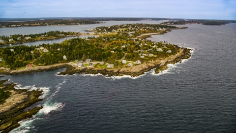AX147_378.0000290 - Aerial stock photo of A coastal town on Bailey Island in autumn, Harpswell, Maine