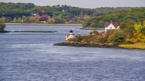 AX147_402.0000000 - Aerial stock photo of Squirrel Point Light and autumn foliage, Arrowsic, Maine