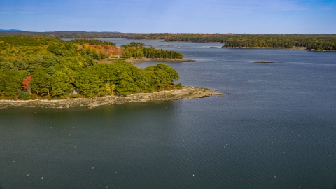 AX148_029.0000234 - Aerial stock photo of Forested islands, The Narrows in autumn, Waldoboro, Maine