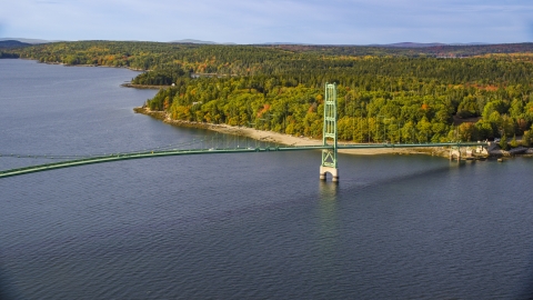 AX148_140.0000173 - Aerial stock photo of The Deer Isle Bridge in autumn, Little Deer Isle, Maine