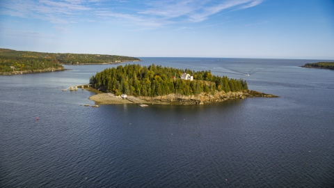 AX148_166.0000000 - Aerial stock photo of Bear Island Light and trees on Bear Island, Maine
