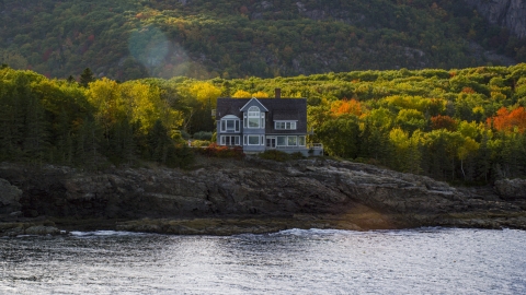 AX148_184.0000000 - Aerial stock photo of A waterfront mansion in autumn, Bar Harbor, Maine