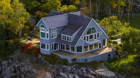 AX148_185.0000000 - Aerial stock photo of A waterfront mansion on a rocky coast, autumn, Bar Harbor, Maine