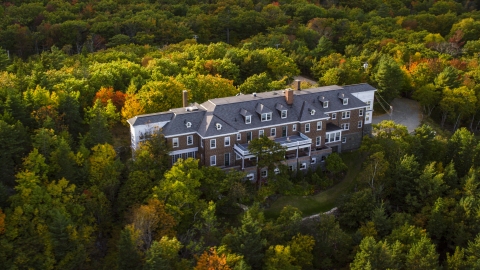 AX148_187.0000000 - Aerial stock photo of An isolated mansion, trees with autumn leaves, Bar Harbor, Maine