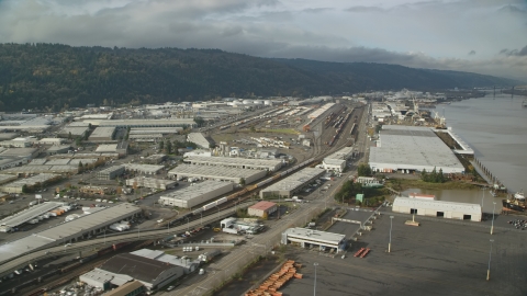 AX153_059.0000361F - Aerial stock photo of Riverfront warehouses in autumn, Northwest Portland, Oregon