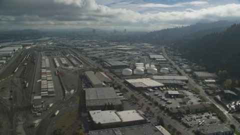 AX153_063.0000297F - Aerial stock photo of Warehouses and train yard in an industrial area, Northwest Portland, Oregon