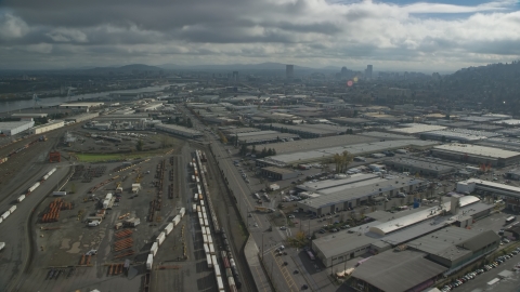 AX153_065.0000000F - Aerial stock photo of A train yard and warehouse buildings in Northwest Portland, Oregon