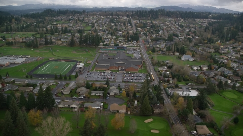 AX153_173.0000150F - Aerial stock photo of Washougal High School and sports fields in Washougal, Washington