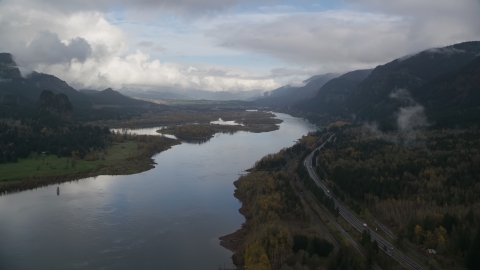 AX154_024.0000000F - Aerial stock photo of Columbia River and I-84 near Columbia River Gorge islands