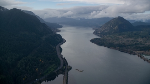 AX154_157.0000279F - Aerial stock photo of The Columbia River and the I-84 highway in Columbia River Gorge