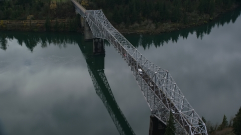 AX154_173.0000195F - Aerial stock photo of Traffic crossing Bridge of the Gods in Cascade Locks, Columbia River Gorge, Oregon