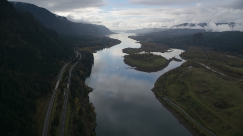 AX154_179.0000286F - Aerial stock photo of The Columbia River and I-84 highway near islands in Columbia River Gorge
