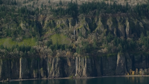 AX154_193.0000228F - Aerial stock photo of Waterfalls and steep green cliffs on the Washington side of Columbia River Gorge