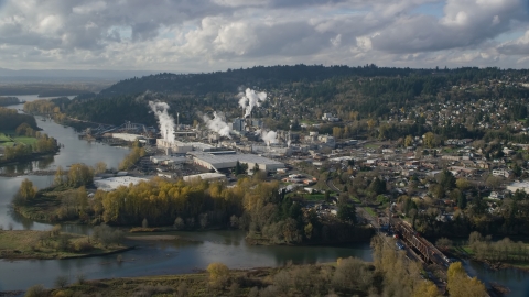 AX154_211.0000254F - Aerial stock photo of The Washougal River and the Georgia Pacific Paper Mill in Camas, Washington