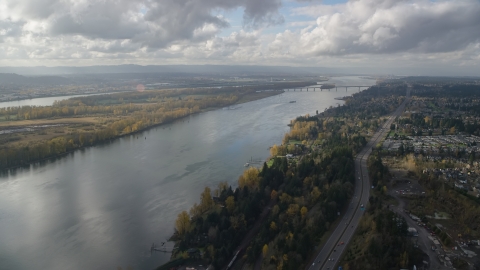 AX154_215.0000243F - Aerial stock photo of Highway 14 and the Columbia River near the I-205 Bridge in Vancouver, Washington