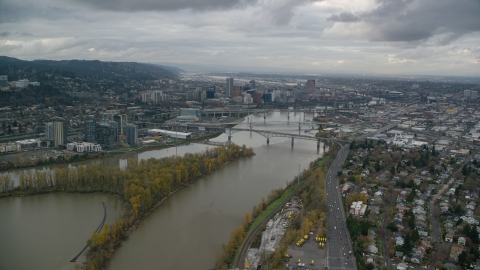 AX155_022.0000225F - Aerial stock photo of South Waterfront condo high-rises, bridges over the Willamette River, and Downtown Portland, Oregon