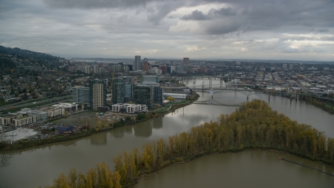 AX155_026.0000098F - Aerial stock photo of Willamette River and Ross Island, South Waterfront and Downtown Portland, Oregon