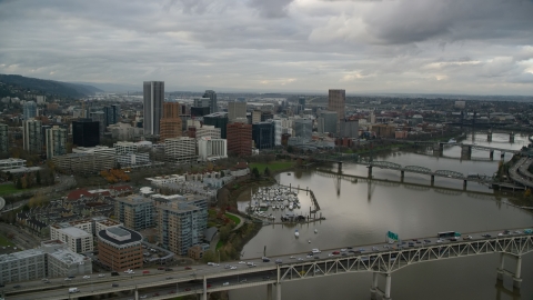 AX155_028.0000228F - Aerial stock photo of Marquis Bridge, Riverplace Marina and Downtown Portland, Oregon