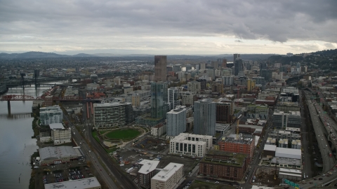 AX155_036.0000383F - Aerial stock photo of Fremont Bridge skyscrapers in Downtown Portland, Oregon