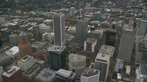 AX155_105.0000165F - Aerial stock photo of KOIN Center, Wells Fargo Center, PacWest Center, Portland City Hall, and high-rises in Downtown Portland, Oregon