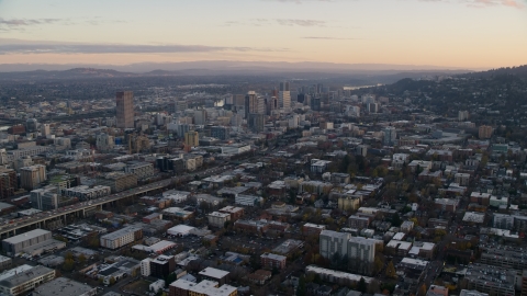 AX155_143.0000304F - Aerial stock photo of Northwest Portland at sunset, I-405 and Downtown Portland, Oregon