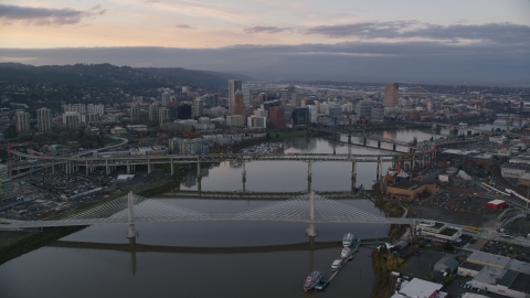 AX155_171.0000237F - Aerial stock photo of Willamette River and bridges, Downtown Portland at sunset, Oregon