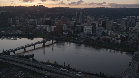 AX155_178.0000242F - Aerial stock photo of The Willamette River and Downtown Portland at sunset in Oregon