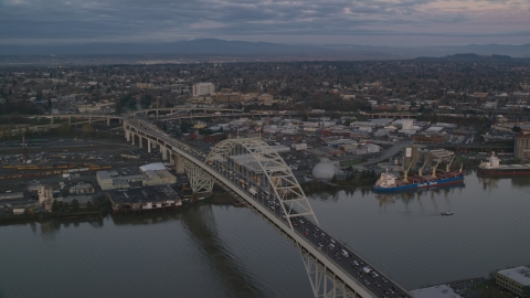 AX155_182.0000216F - Aerial stock photo of The Fremont Bridge with very heavy traffic at sunset, Portland, Oregon