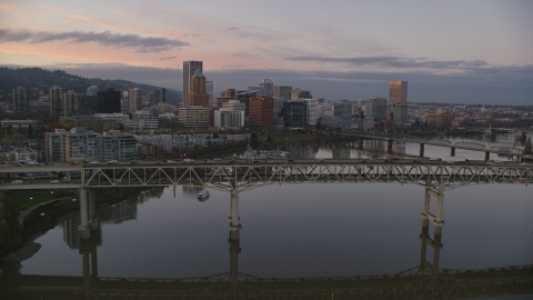 AX155_201.0000000F - Aerial stock photo of Marquam Bridge, near marina, Hawthorne Bridge, and downtown skyline at sunset, Downtown Portland, Oregon