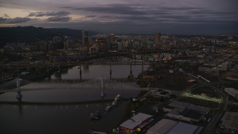 AX155_249.0000359F - Aerial stock photo of Downtown skyscrapers and bridges over the Willamette River at sunset, Downtown Portland, Oregon