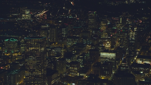 AX155_332.0000268F - Aerial stock photo of Downtown US Bancorp Tower, high-rises and skyscrapers at night, Downtown Portland, Oregon