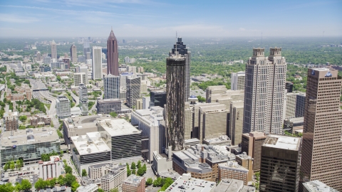 AX36_006.0000025F - Aerial stock photo of Office buildings near skyscrapers, Westin Peachtree Plaza Hotel, Downtown Atlanta, Georgia