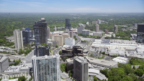 AX36_069.0000188F - Aerial stock photo of Skyscrapers and office buildings near a shopping center, Buckhead, Georgia