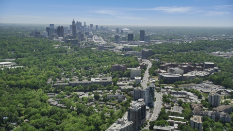AX36_082.0000067F - Aerial stock photo of High above office buildings looking toward Midtown Atlanta skyline; Buckhead, Georgia