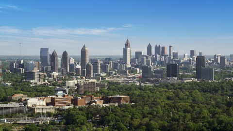 AX38_030.0000205F - Aerial stock photo of Midtown Atlanta skyline, hazy, Buckhead, Georgia