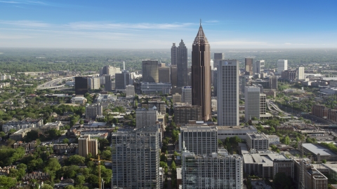 AX38_065.0000020F - Aerial stock photo of Bank of America Plaza and skyscrapers in Midtown Atlanta, Georgia