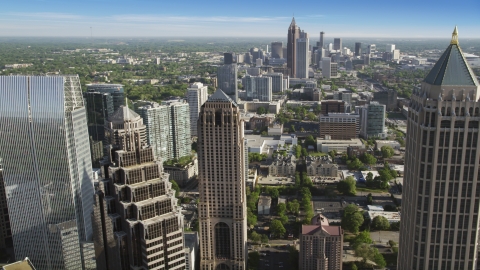 AX38_067.0000101F - Aerial stock photo of Midtown skyscrapers, Downtown the distance, Atlanta, Georgia