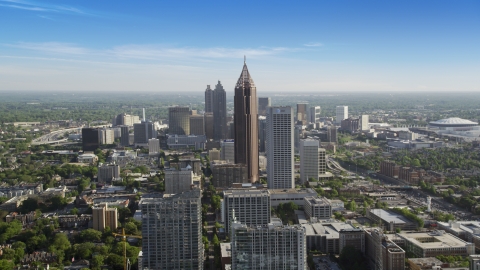 AX38_069.0000036F - Aerial stock photo of Bank of America Plaza towering over city buildings, Midtown Atlanta, Georgia 