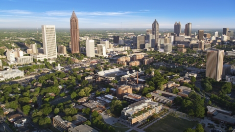 AX39_028.0000238F - Aerial stock photo of Atlanta skyscrapers and Bobby Dodd Stadium, Georgia