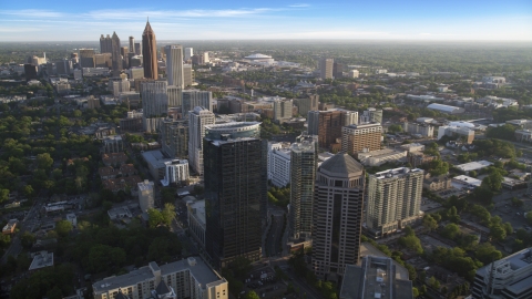AX39_033.0000165F - Aerial stock photo of Midtown Atlanta skyscrapers with Downtown in the background, Georgia