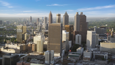 AX39_045.0000122F - Aerial stock photo of Skyscrapers and high-rises under hazy skies, Downtown Atlanta, Georgia
