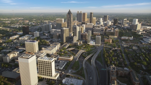 AX39_063.0000317F - Aerial stock photo of Downtown Connector toward Downtown skyscrapers, Atlanta