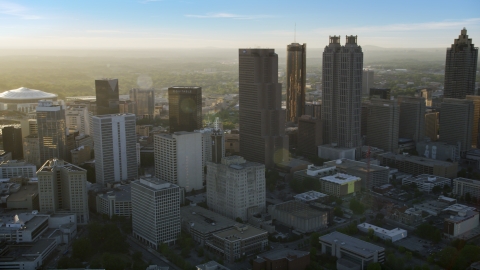 AX39_066.0000060F - Aerial stock photo of Downtown Atlanta skyscrapers at sunset with hazy skies, Georgia
