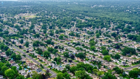AXP071_000_0003F - Aerial stock photo of Suburban homes in a Massapequa Park neighborhood, Long Island, New York