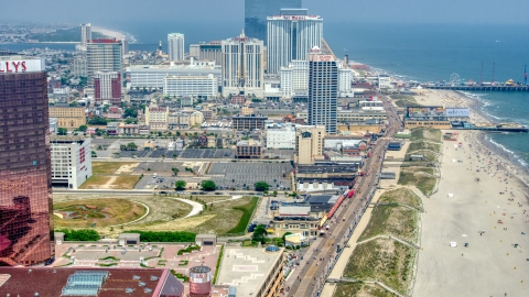 AXP071_000_0017F - Aerial stock photo of The boardwalk by hotels in Atlantic City, New Jersey