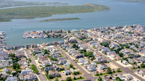 AXP071_000_0029F - Aerial stock photo of Waterfront homes by Snug Harbor in Stone Harbor, New Jersey