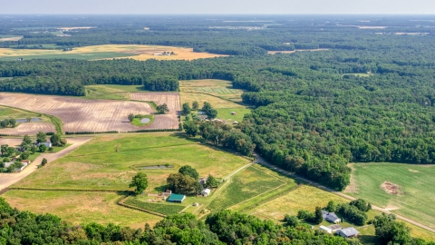 AXP072_000_0005F - Aerial stock photo of Farmland and barns in Hartly, Delaware
